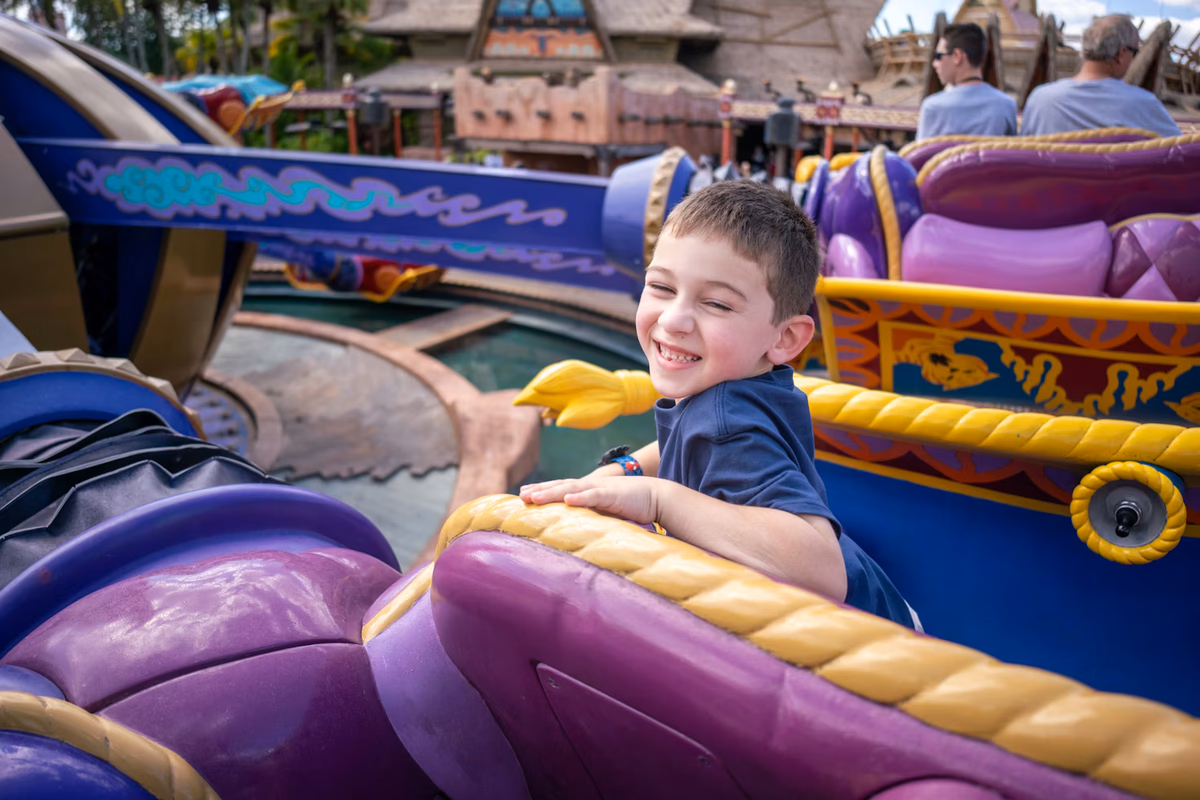 Boy riding magic carpet ride